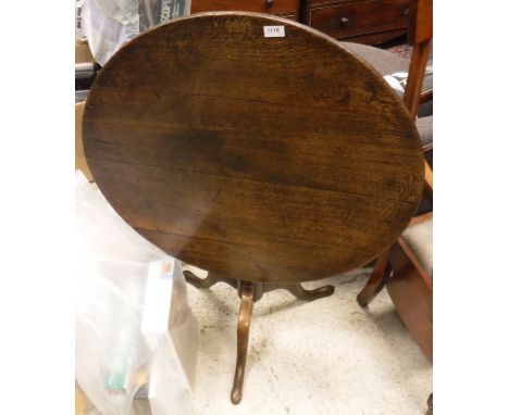 A 19th Century mahogany tea table, the circular snap top on baluster turned pedestal to cabriole tripod base and pad feet tog