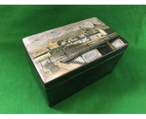 A 19th Century Russian lacquered tea caddy, the main body black, the top decorated with the Kremlin