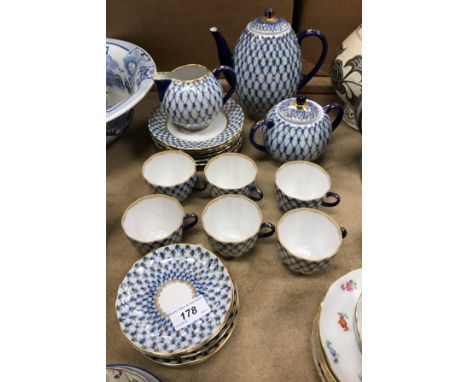 A Lomonosov USSR "Cobalt Net" blue and gilt decorated porcelain, six place coffee set comprising coffee pot, sugar basin and 