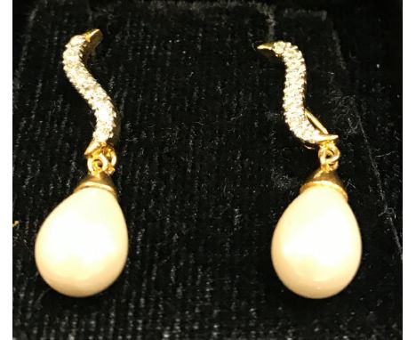 A pair of white gold and diamond set pearl drop earrings