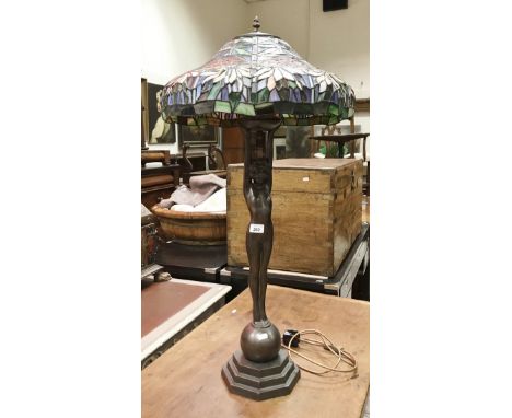 A modern Tiffany style figural table lamp