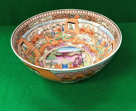 A Chinese Qianlong style fruit bowl, the centre field polychrome decorated with figures in a garden setting, the circular foo