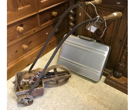 A vintage white line marker and a briefcase