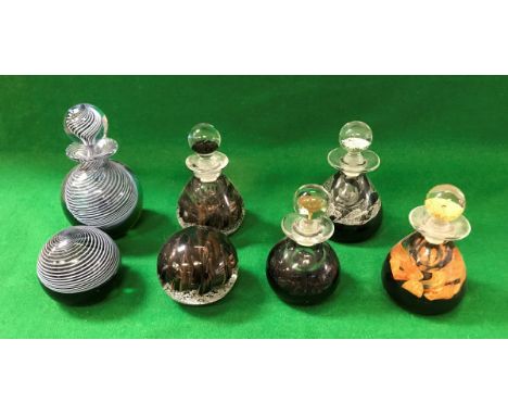 A Caithness black and gold perfume bottle and paperweight, No'd. 96/100, together with a Caithness "Curio" perfume bottle and