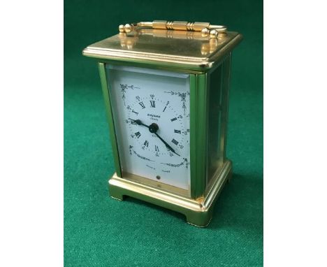 A modern brass carriage clock, the enamel clock set with Roman numerals inscribed "Bayard Paris 8 day", the back interior ins