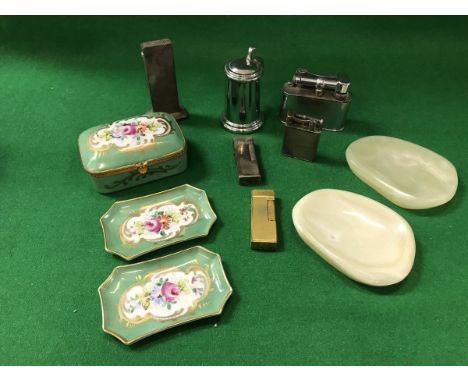 A collection of six various Dunhill lighters to include one in the form of a tankard, together with a Dunhill porcelain box w