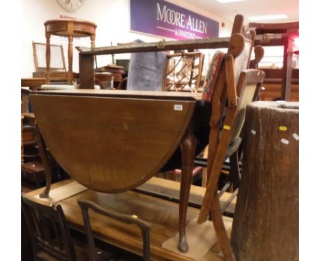 A 19th Century mahogany oval drop-leaf dining table with unusual belt decoration on legs, together with a 19th Century oak th