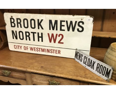 A vintage enamel road sign inscribed "Brooke Mews North W2 City of Westminster"