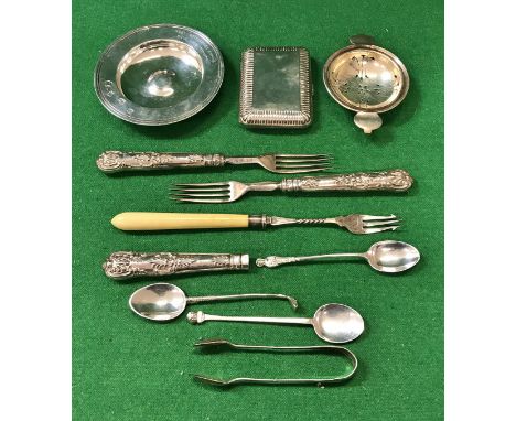 A collection of small silver wares to include silver Armada dish, three various teaspoons, sugar tongs, cigarette case, 8.52 