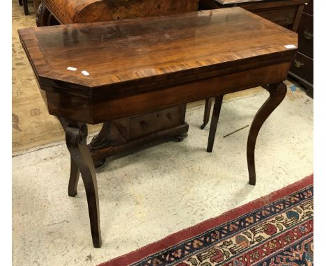 A 19th Century rosewood card table the top with cross-banded decoration opening to reveal a baize interior raised on square s