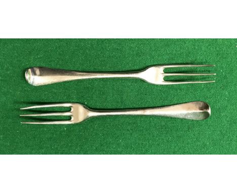 A set of twelve George I silver three pronged "Hanoverian" pattern forks (by Charles Jackson, 1723), 24.15 oz CONDITION REPOR