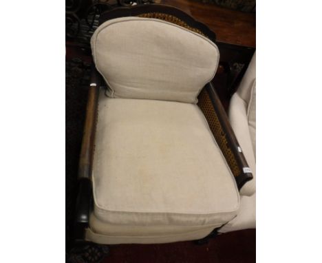 A circa 1900 Bergere two seat sofa together with two matching armchairs 