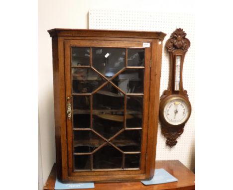 A Victorian oak cased barometer / thermometer, together with a George III oak hanging corner cupboard