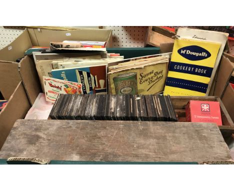 A box of various magic lantern slides, vintage tea cards, various old cookery pamphlets together with a box of various camera