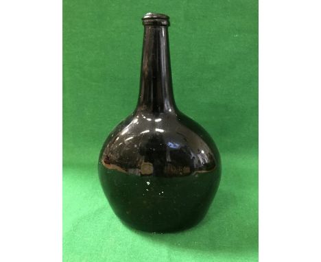 An 18th Century black glass bottle of moon flask form CONDITION REPORTS Main body of the bottle has many scratch marks to the