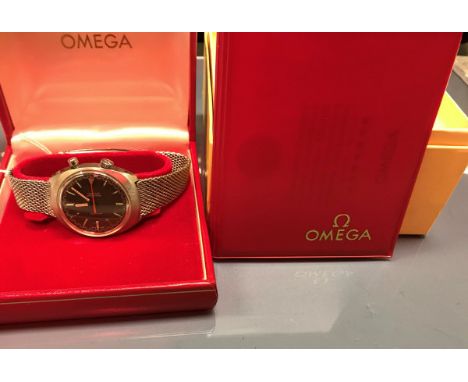 An Omega Chronostop steel cased wristwatch with mesh link strap, movement No. 865-25871847, circa 1968, housed in a red leath