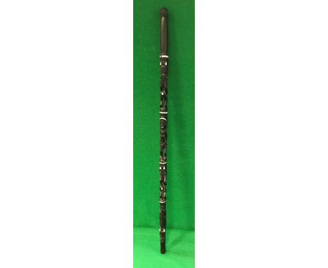 A 20th Century Papua New Guinea mother of pearl inlaid ebony ceremonial walking stick with figural and mask decoration 