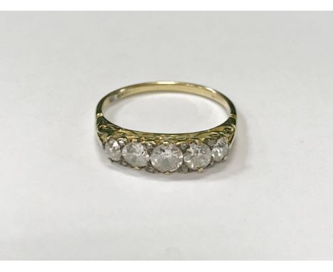 A five stone graduated diamond dress ring, the centre stone approx 1 carat total, 3.3 g, size T CONDITION REPORTS Diameter of