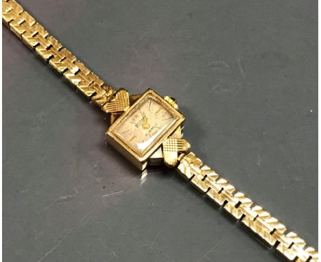 A ladies Rotary 9 carat gold cased wristwatch with 9 carat gold flat link bracelet CONDITION REPORTS Total weight approx. 15.