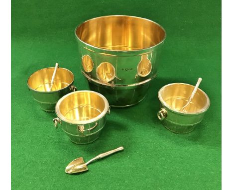 An Asprey silver bowl of coopered barrel form with gilt-washed interior, together with a set of three matching smaller bowls 