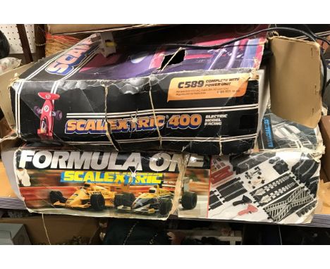 A Scalextric 400-C589 kit (boxed) together with another "Formula One" and a box of various track and vehicle spares
