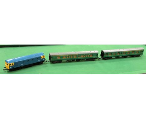 A Lima O gauge British Rail diesel loco together with five Lima carriages