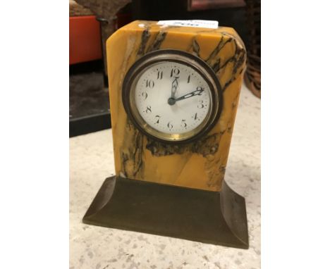 An Art Deco mantel clock, the white enamel dial set with Arabic numerals, the base stamped "Depose" and No'd 1795