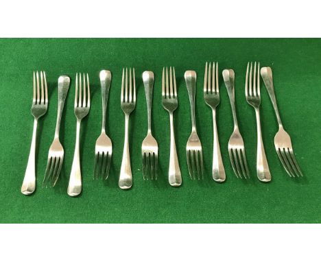 A set of eleven George VI silver "Rat Tail" dessert forks (by Emile Viner, Sheffield 1937), 17.58 oz, together with one plate