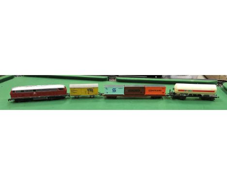 A Rivarossi O gauge diesel locomotive, various rolling stock including Lima Mobil Oil fuel tanker, Hornby livestock truck and