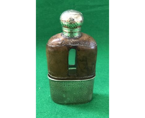 A Victorian leather bound glass spirit flask with planished silver mounts and cup (London 1888), 2.72 oz weighable silver