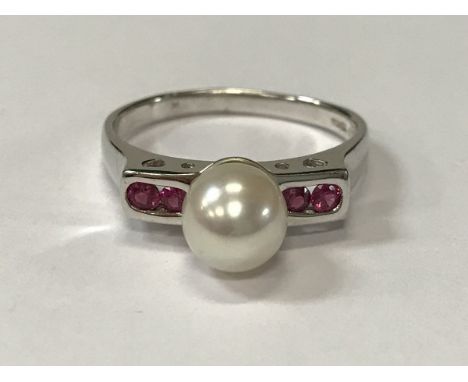 A 9 carat white gold and pearl ring set with two pairs of pink stones, size X