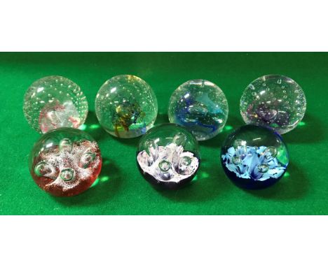 A collection of seven Caithness paperweights comprising "Reflections 91", "Reflections 93", "Reflections Magenta", "Reflectio