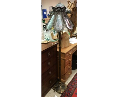 A Tiffany style leaded glazed standard lamp with matching table lamp and a further similar table lamp