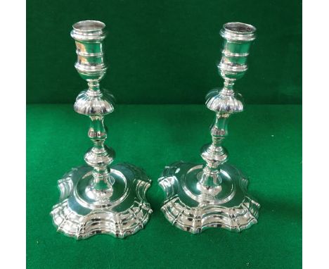 A pair of George II cast silver Rococo candlesticks (by Phillips Garden, London 1743), 18 cm high, 25.72 oz CONDITION REPORTS