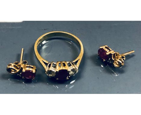 A three stone diamond and ruby ring and a pair of ear studs, 3.8 g total, size O