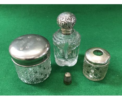 A cut glass and silver mounted dressing table scent bottle, a hobnail cut glass silver mounted hair net jar and plated thimbl