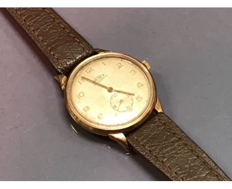 A 9 carat gold cased gentleman's wristwatch, the movement by Trebex, the silvered dial with Arabic numerals and subsidiary se