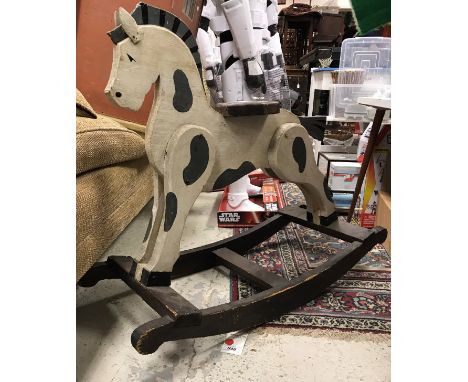 A vintage dapple painted rocking horse of small proportions 