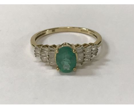 A 9 carat gold emerald and diamond ring, size Q