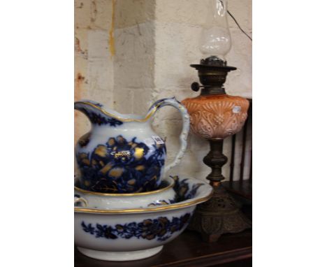 A Victorian oil lamp and a three piece Cauldon wash set