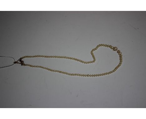 A pearl and cultured pearl necklace, the Baroque beads graduated approx. 6.2mm-3.0mm, knotted on a modern trigger clasp, appr