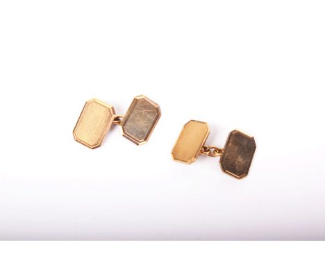 A pair of 9ct gold engine-turned canted-rectangular twin-panel cufflinks with chain interlinks, Birmingham 1962, 8.2g