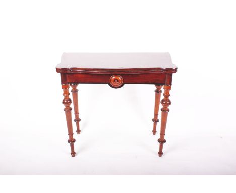 A late Victorian mahogany fold over swivel action card/breakfast table with turned legs and shaped top, 90cm wide