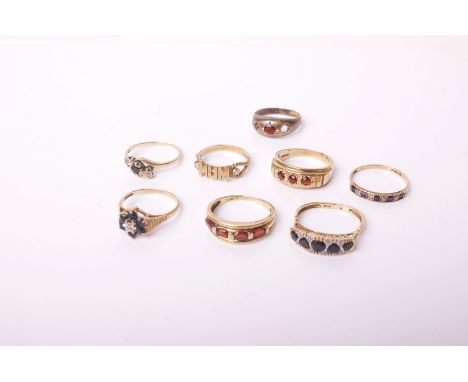 Three gold and gem set rings and a collection of costume jewellery, comprising, an oval sapphire seven stone open cluster rin