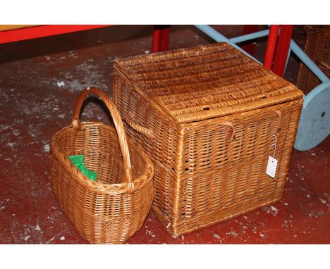 A cane work hamper with leather straps, 48cm wide, 44cm high, 48cm deep; together with a basket