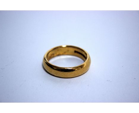 A 22ct gold wedding band, Birmingham, 1962 by Charles Green & Son, size R, 11.1g.