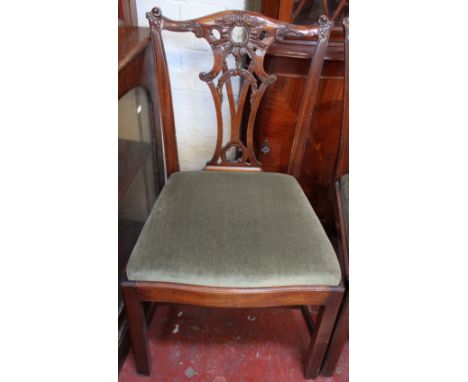 A set of four Chippendale design Georgian style chairs in carved mahogany