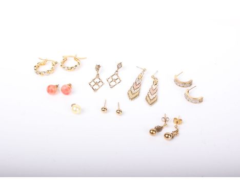 A collection of earrings, including; a pair of coral bead studs, 8.5mm diameter; two pairs of yellow metal beads; a pair of m
