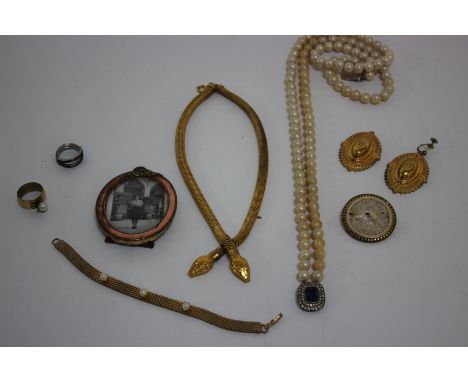 A collection of costume and other jewellery to include a red, blue and near colourless paste 'hinged' Eternity ring; a shell 