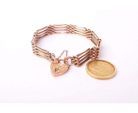 Sovereign, 1872 (M), loosely mounted in a modern gold pendant mount & hung from an early 20th Century rose gold four-bar gate
